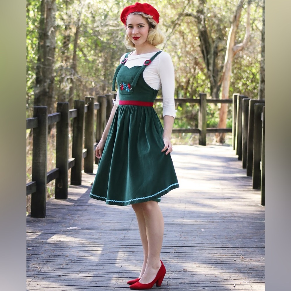 Vintage-Inspired Green Pinafore Dress with Red Accents